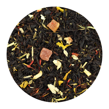 A circular close-up of passion fruit loose loose-leaf black tea blend on a white background