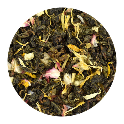 A circular close-up of peach oolong loose-leaf tea blend with dark brown to black rolled leaves mixed with pale yellow dried flowers and small pink accents, shown on a white background.