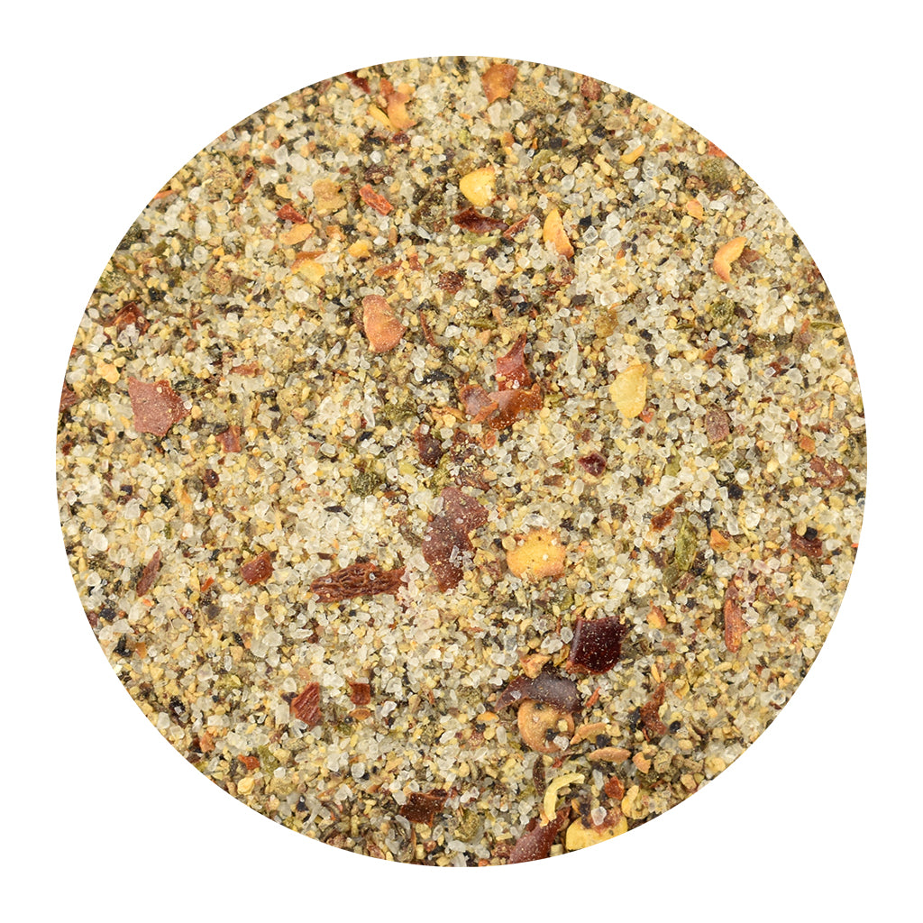 A circular close-up of Pepper Party seasoning, centered on a plain white background.