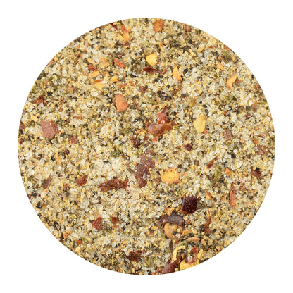A circular close-up of Pepper Party seasoning, centered on a plain white background.