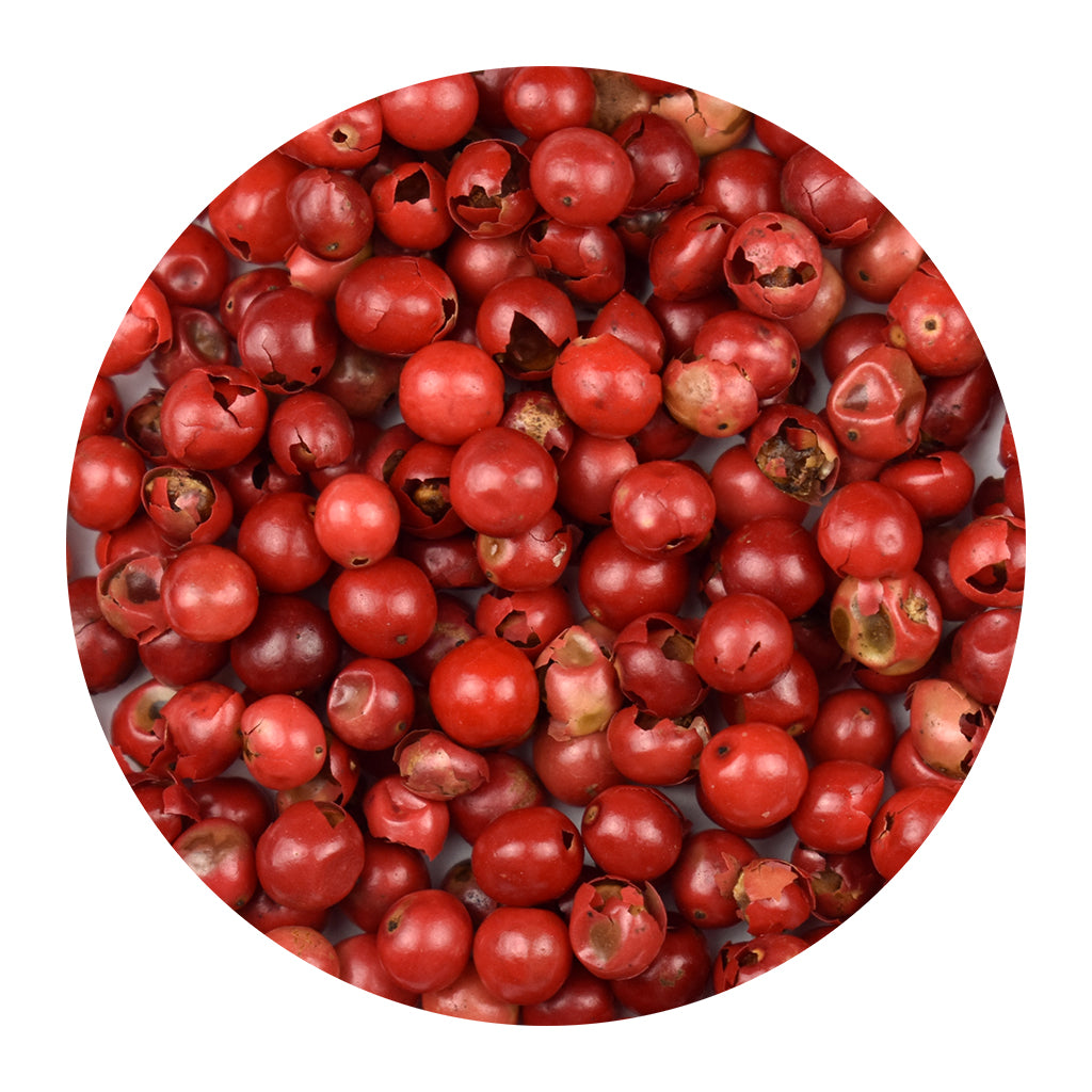 Close-up of pink peppercorns with a white background