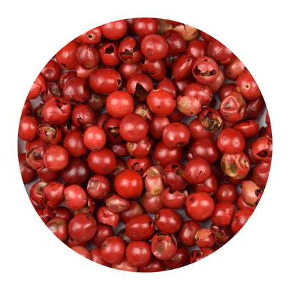 Close-up of pink peppercorns with a white background