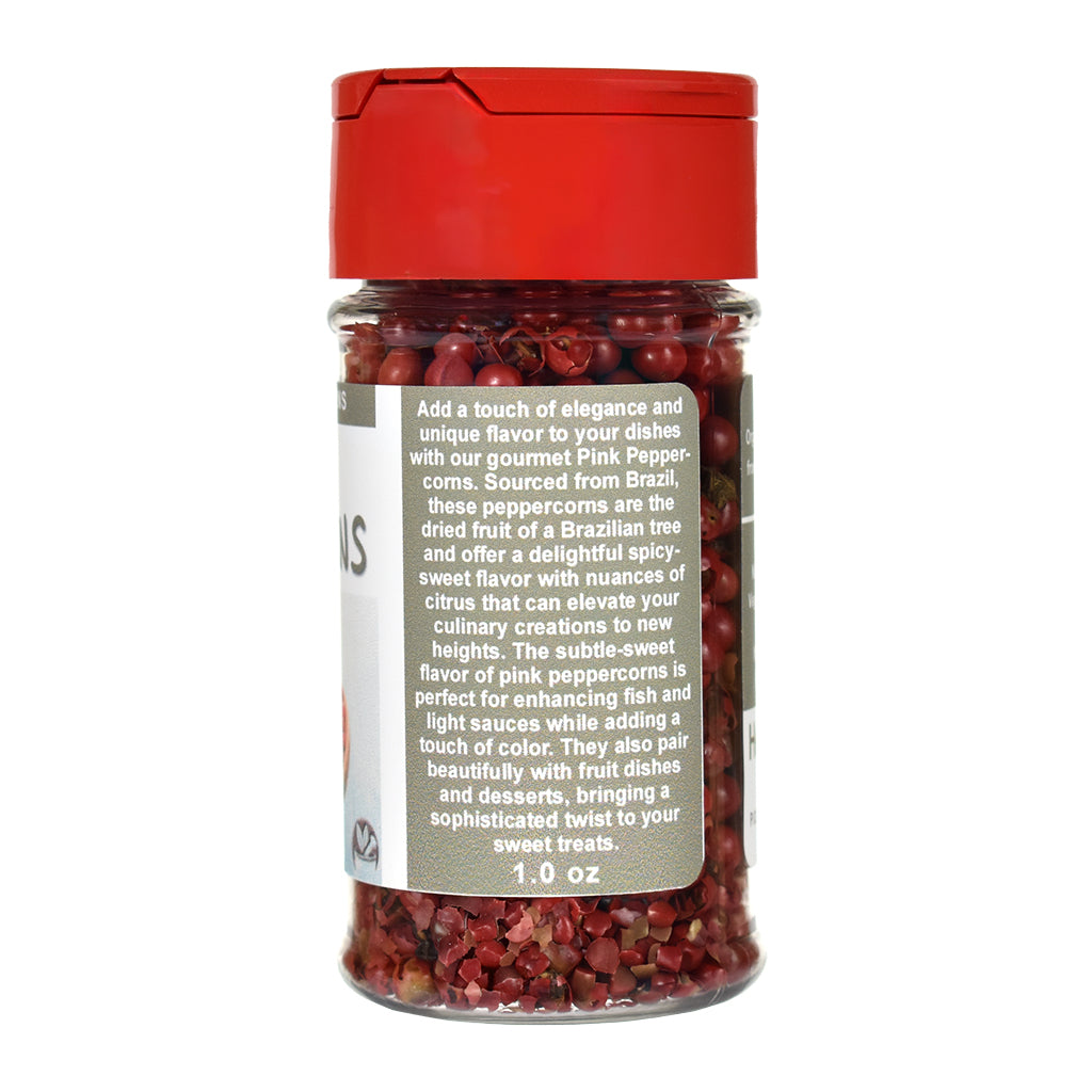 Jar of pink peppercorns with a red lid on a white background