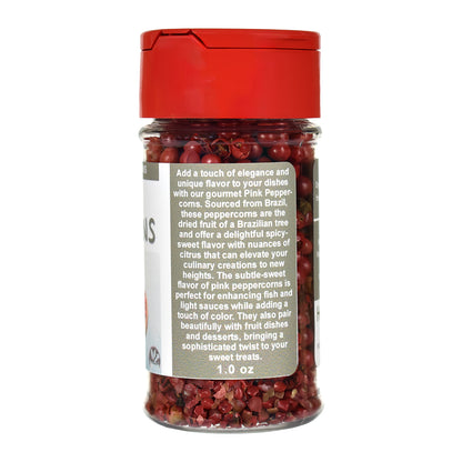 Jar of pink peppercorns with a red lid on a white background