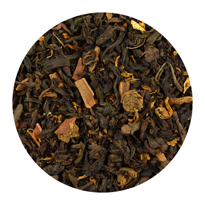 Close-up of Pumpkin Spice Pu-Erh black tea leaves on a white background