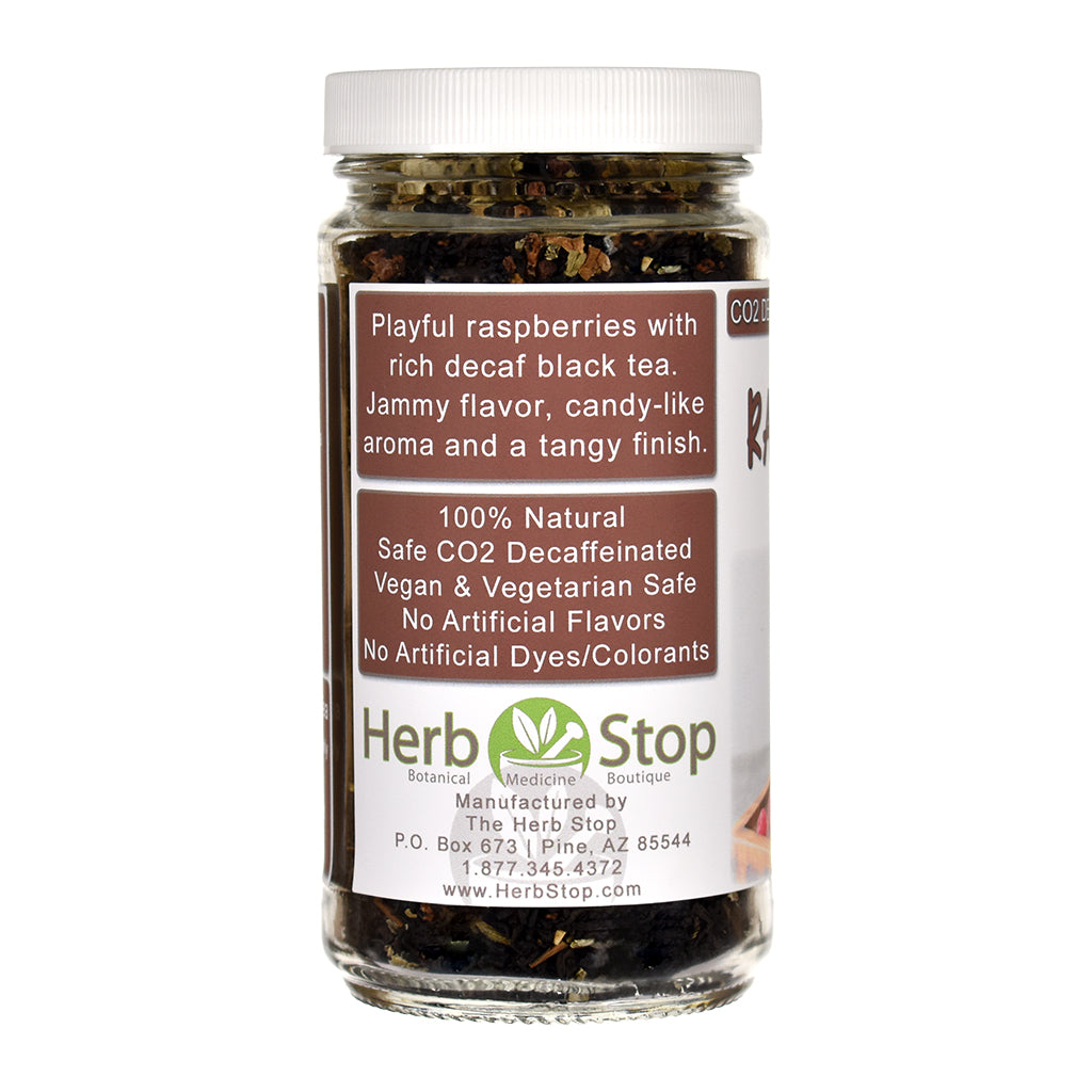 Jar of Raspberry Decaf Black Loose Leaf Tea with 'Herb Stop' label on a white background