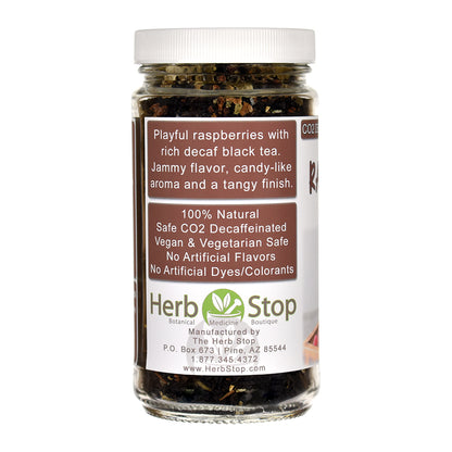 Jar of Raspberry Decaf Black Loose Leaf Tea with 'Herb Stop' label on a white background