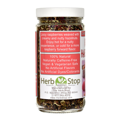Jar of Raspberry Hazelnut Cream Honeybush tea with a label on a white background