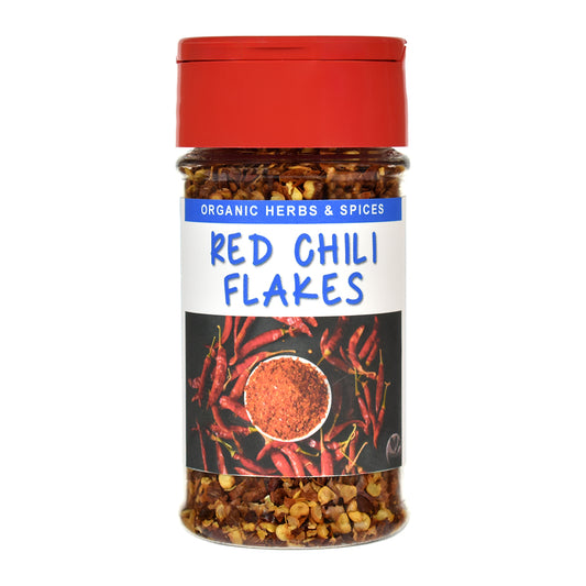 Jar of red chili flakes with a red lid on a white background