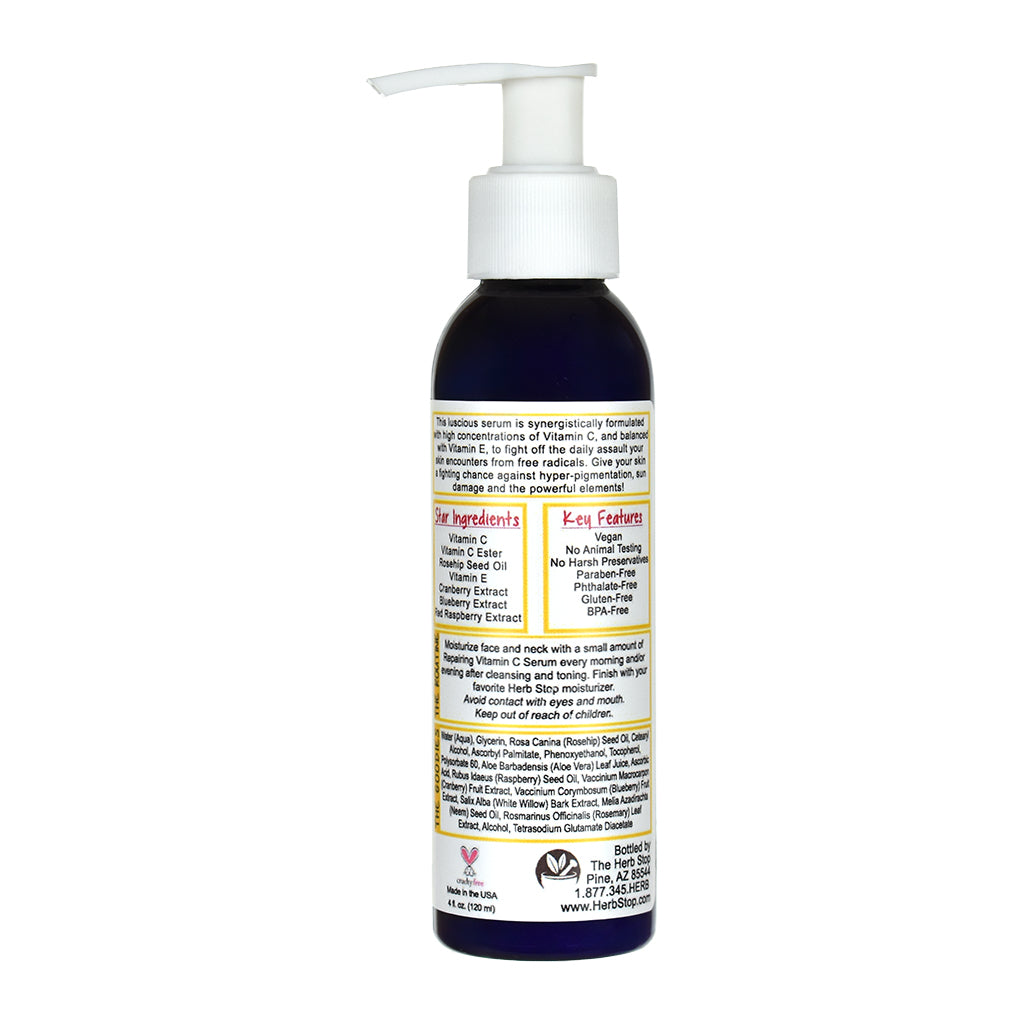 Bottle of Repairing Vitamin C Serum with pump dispenser on a white background