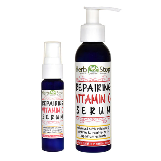 Two bottles of Herb Stop Repairing Vitamin C Serum on a white background