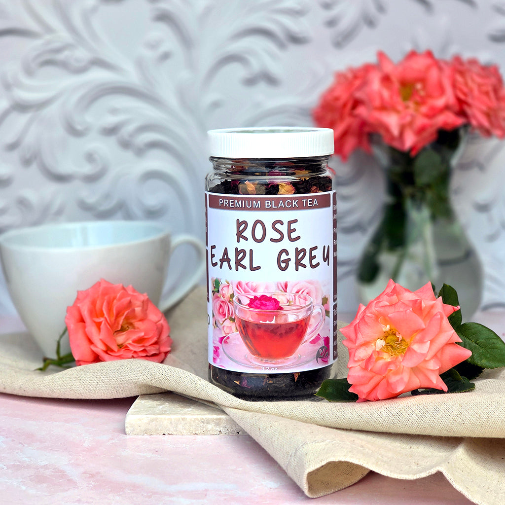 Jar of Herb Stop Rose Earl Grey Black Tea with a tea cup and roses on a decorative surface