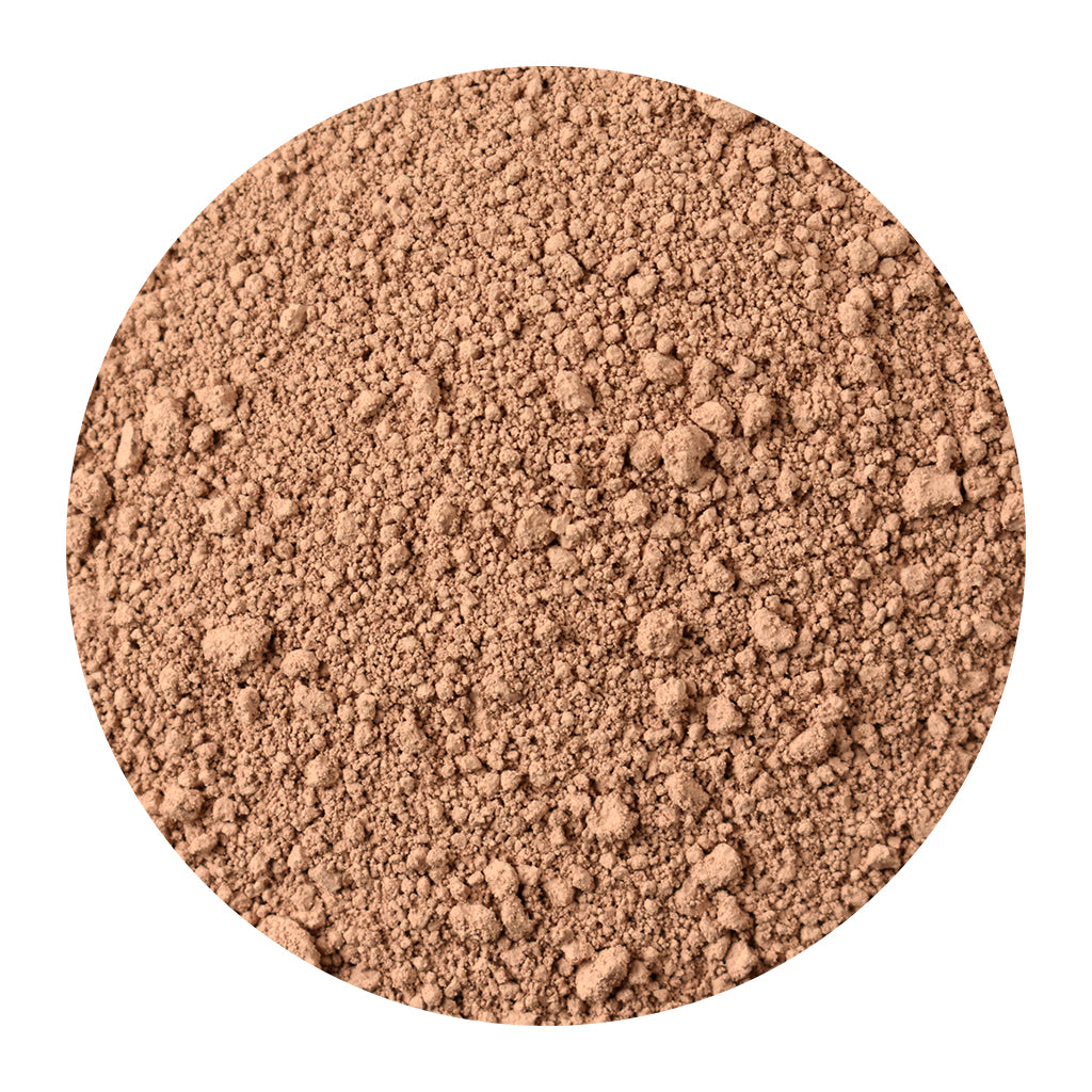 Bulk rose kaolin clay on a white background