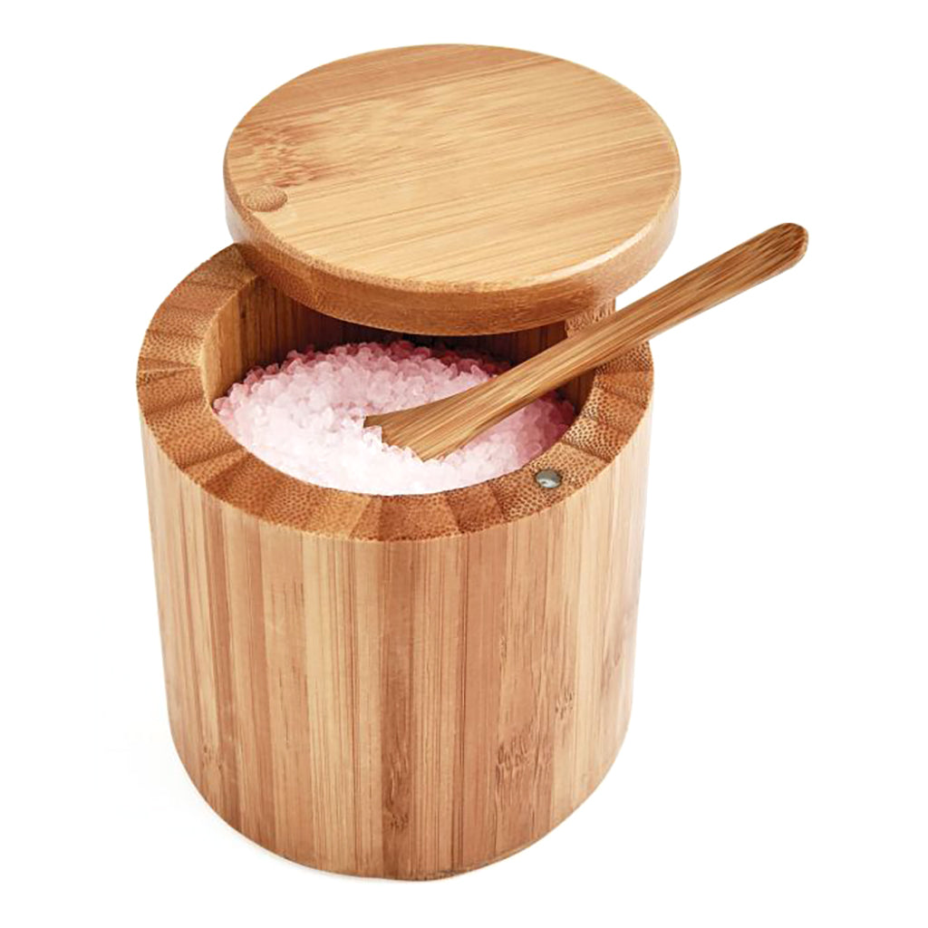 Wooden salt container with pink salt and a wooden spoon on a white background