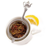 Teapot mesh tea strainer with loose-leaf tea and lemon