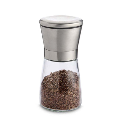 Clear pepper grinder with silver top on a white background
