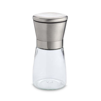 Clear glass spice jar with silver metal grinder lid on a white background