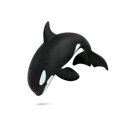 Black orca whale-shaped tea infuser on a white background