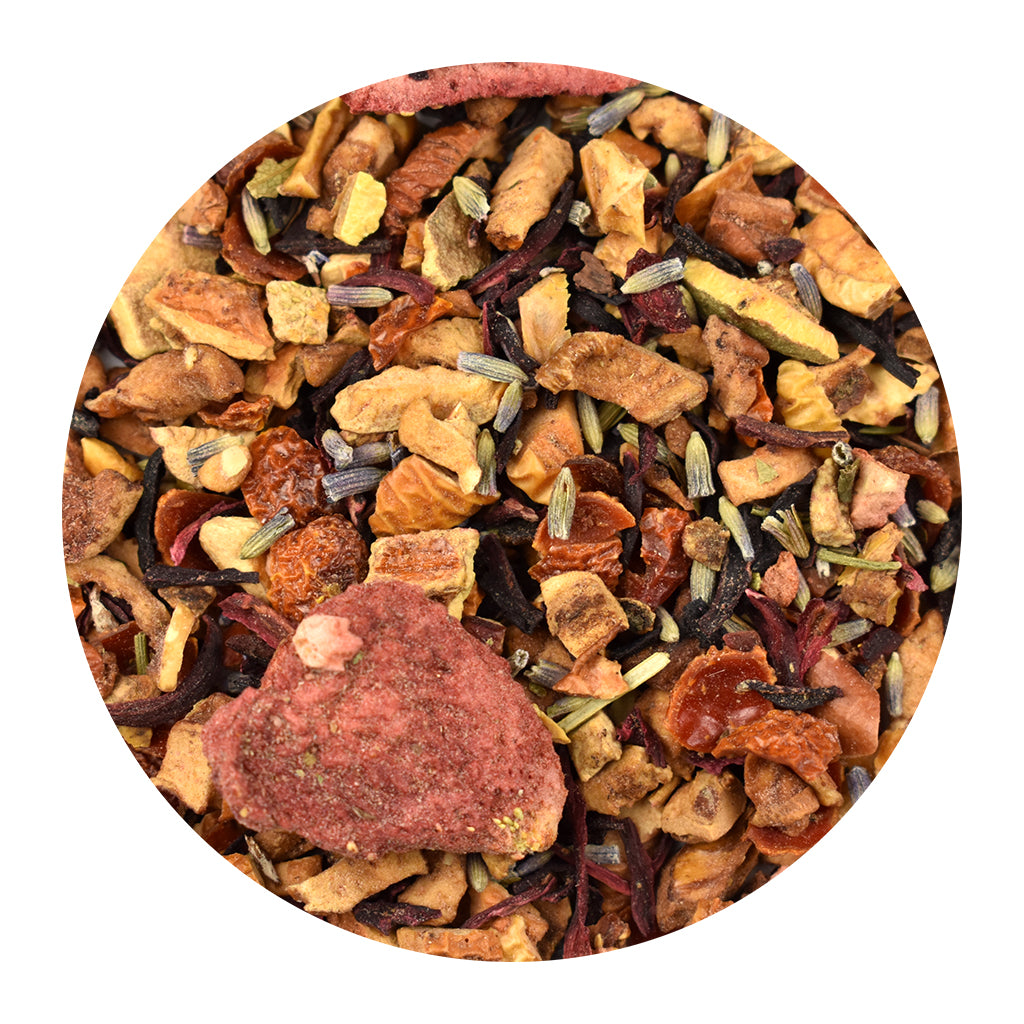 A circular close-up of Strawberry Lavender Herb & Fruit loose-leaf herbal tea blend containing dried fruits and small lavender buds on a white background.