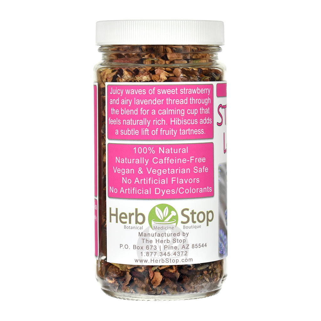 A jar of Herb Stop Lavender & Strawberry herbal tea blend with a white cap and a pink and white label, shown on a white background.