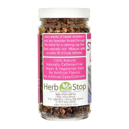 A jar of Herb Stop Lavender & Strawberry herbal tea blend with a white cap and a pink and white label, shown on a white background.