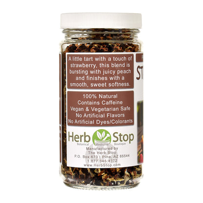 Jar of Strawberry Peach Tea with a label on a white background