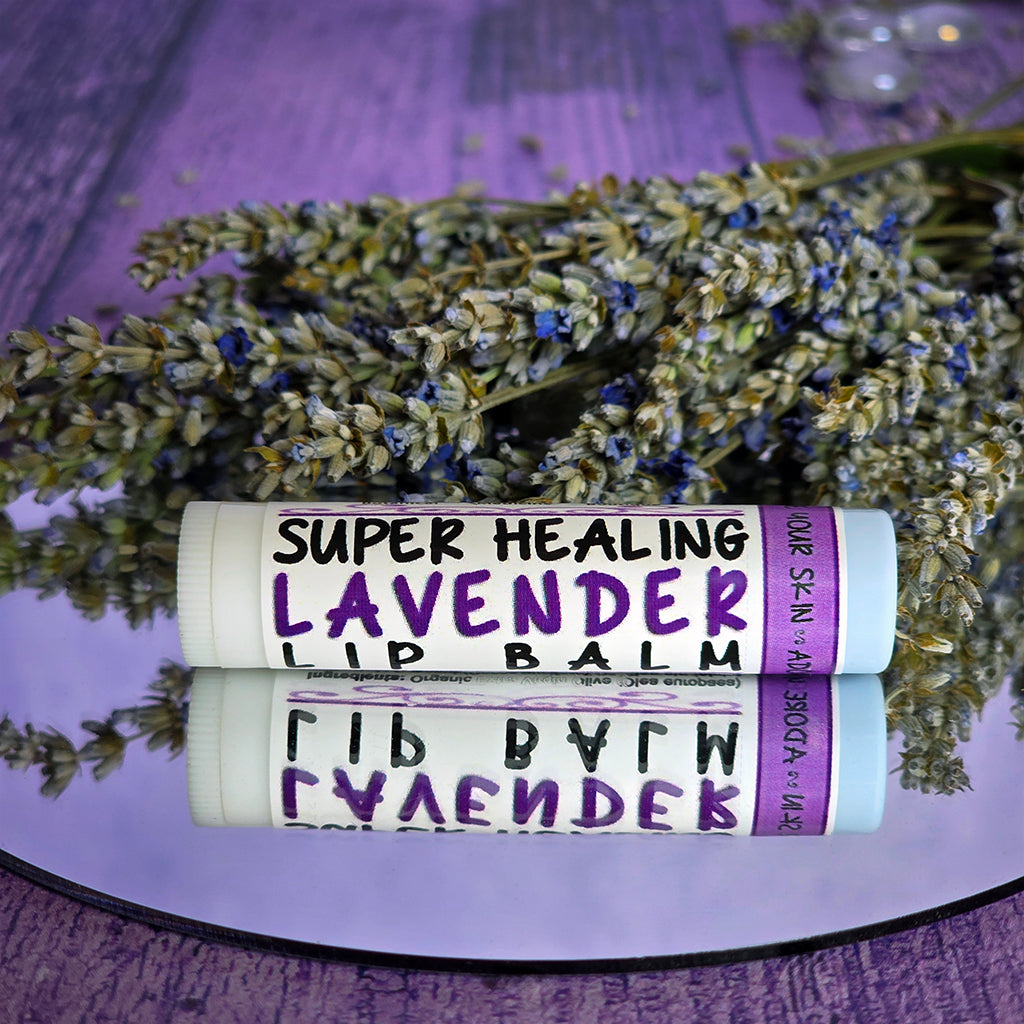Super Healing Lavender lip balm with lavender flowers on a purple background