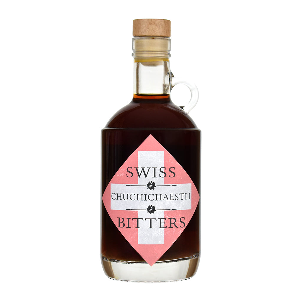 Bottle of Swiss Chuchichaestli Bitters on a white background