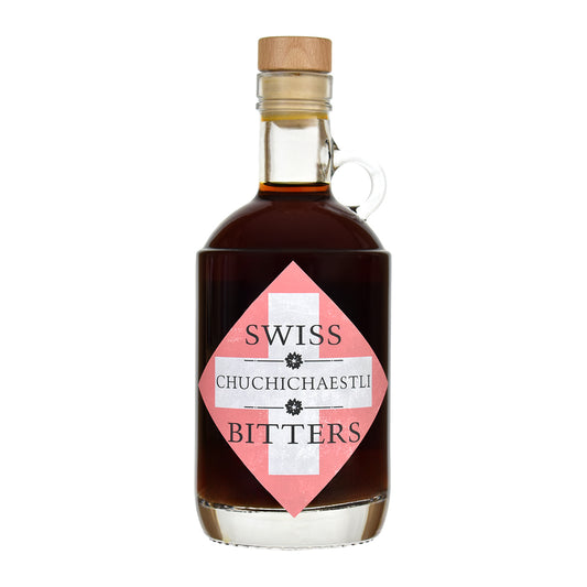 Bottle of Swiss Chuchichaestli Bitters on a white background