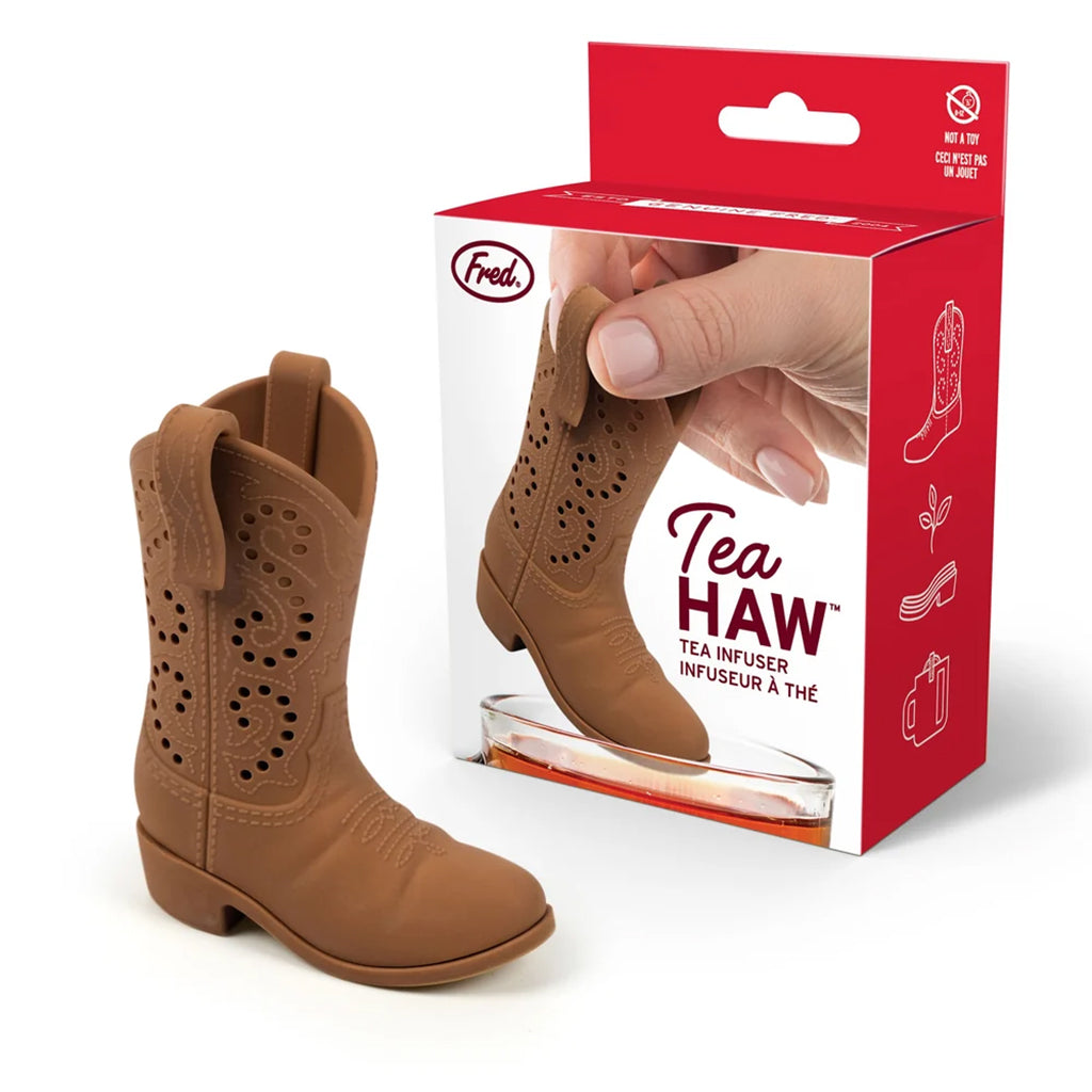 Tea infuser shaped like a cowboy boot with packaging on a white background