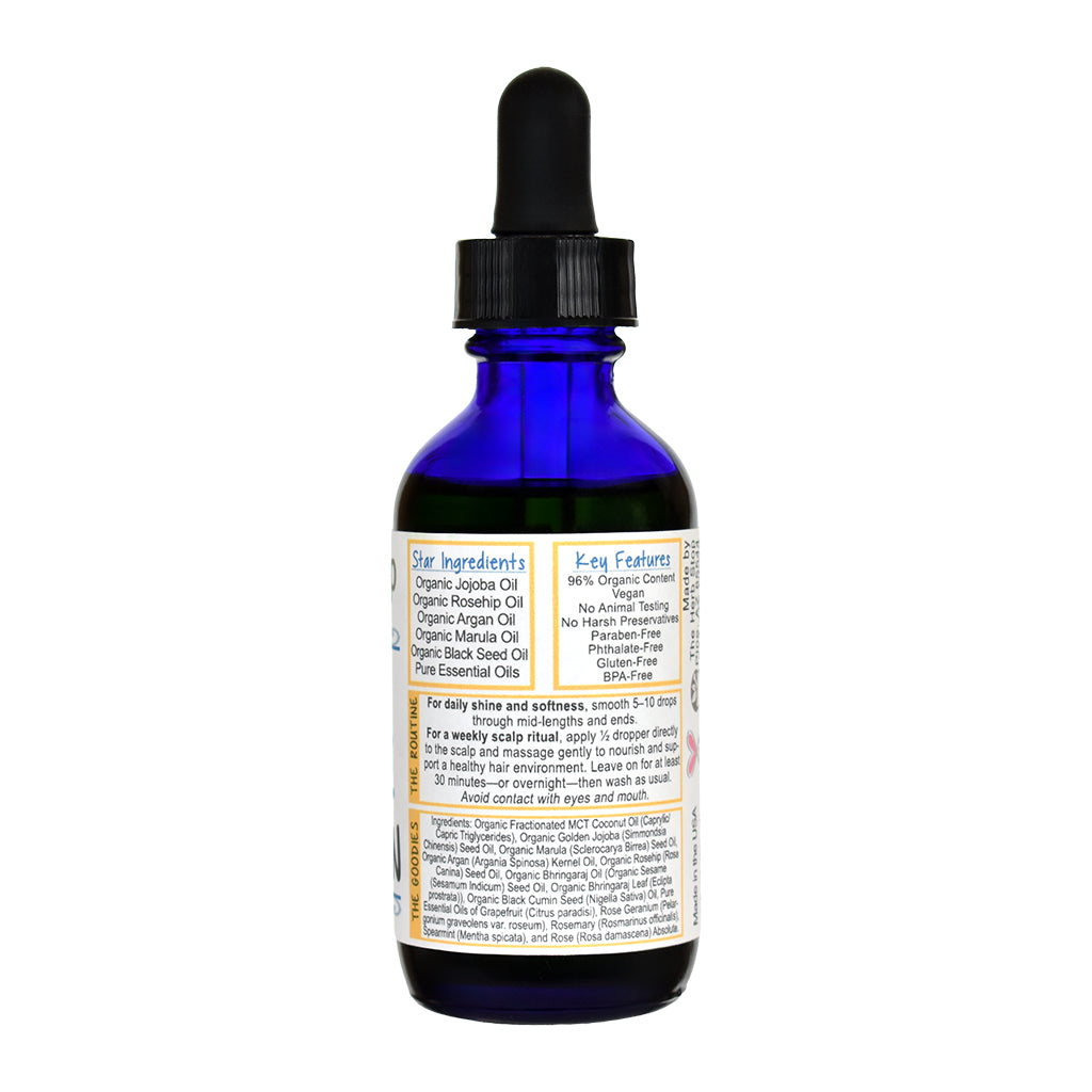 Bottle of Herb Stop's The Mane Obsession Hair Oil on a white background