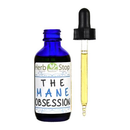 Bottle of Herb Stop's The Mane Obsession Hair Oil with a dropper on a white background