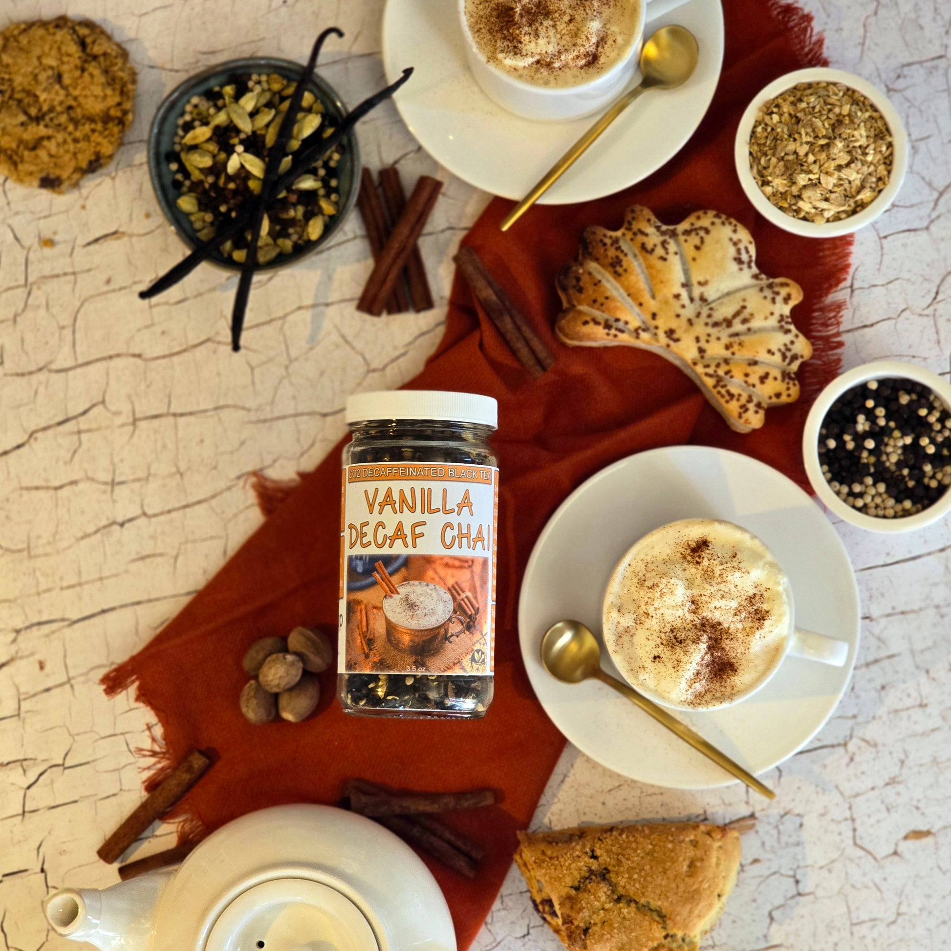 Vanilla Decaf Chai with tea cups and pastries