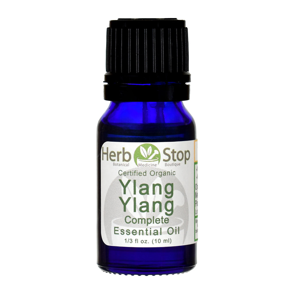 Bottle of Herb Stop Ylang Ylang Complete essential oil on a white background
