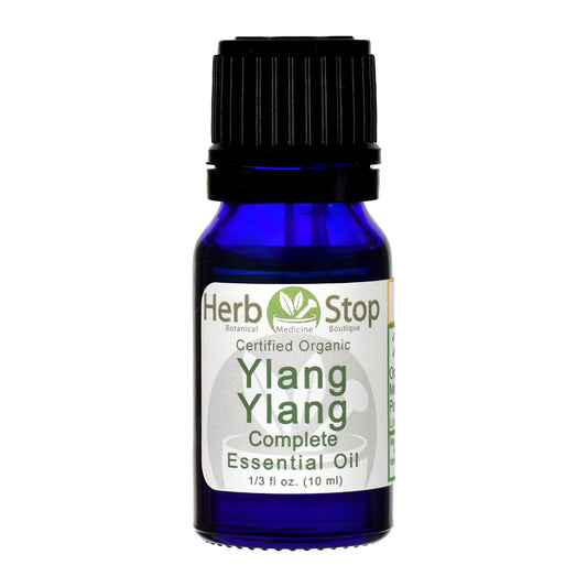 Bottle of Herb Stop Ylang Ylang Complete essential oil on a white background