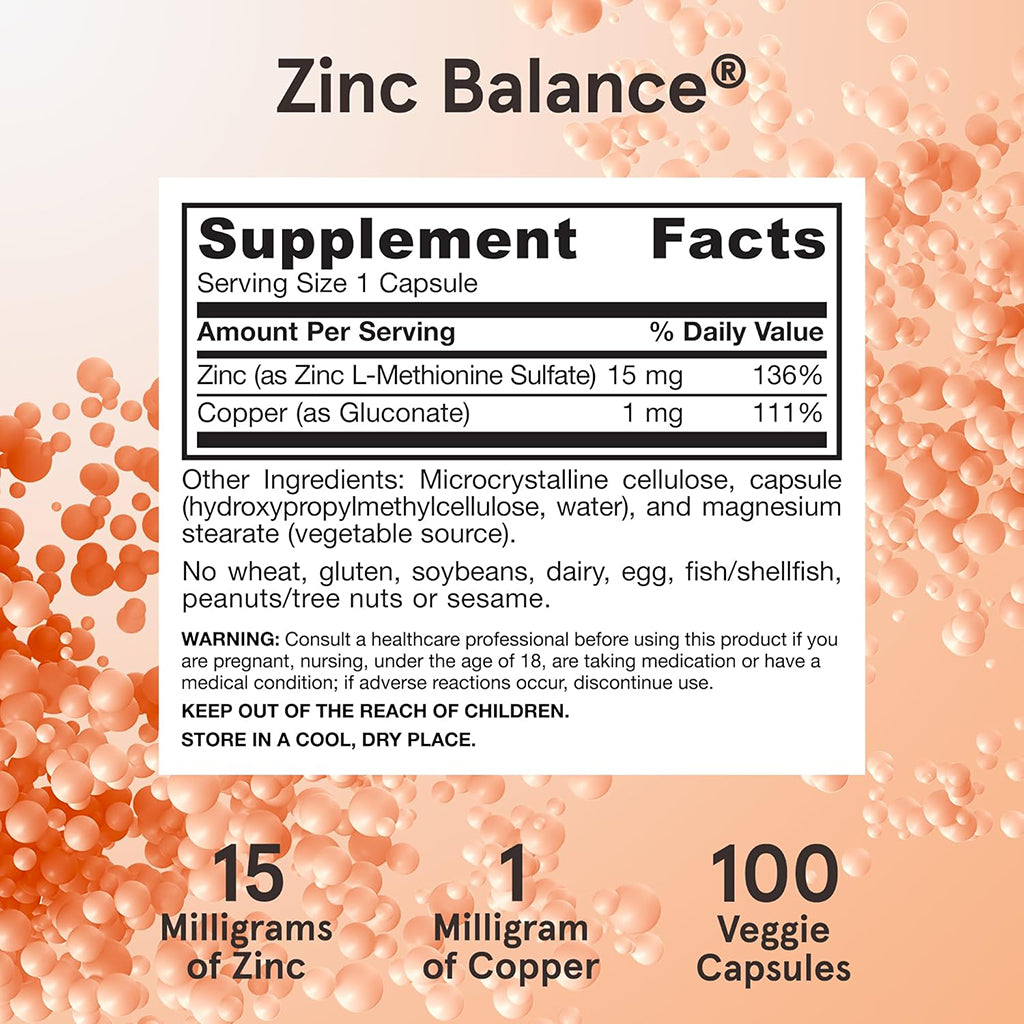 Zinc Balance supplement label with ingredient list and facts on a peach-colored background