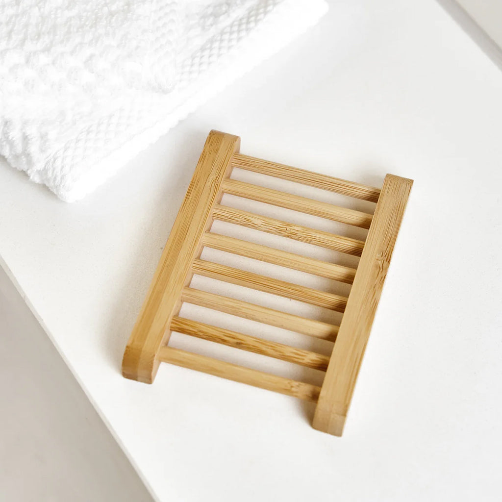 Bamboo soap dish on a white surface