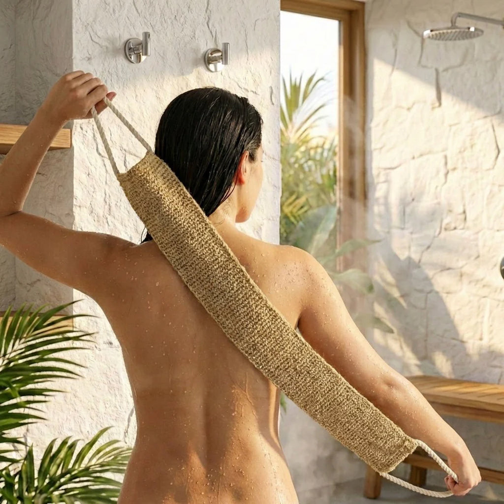 Person using a sisal back scrubber in a bathroom setting with natural light