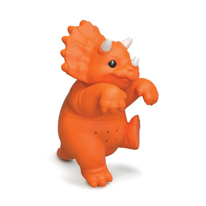 An orange tea infuser shaped like a Triceratops dinosaur, featuring white horns and a smiling face, set against a plain white background.
